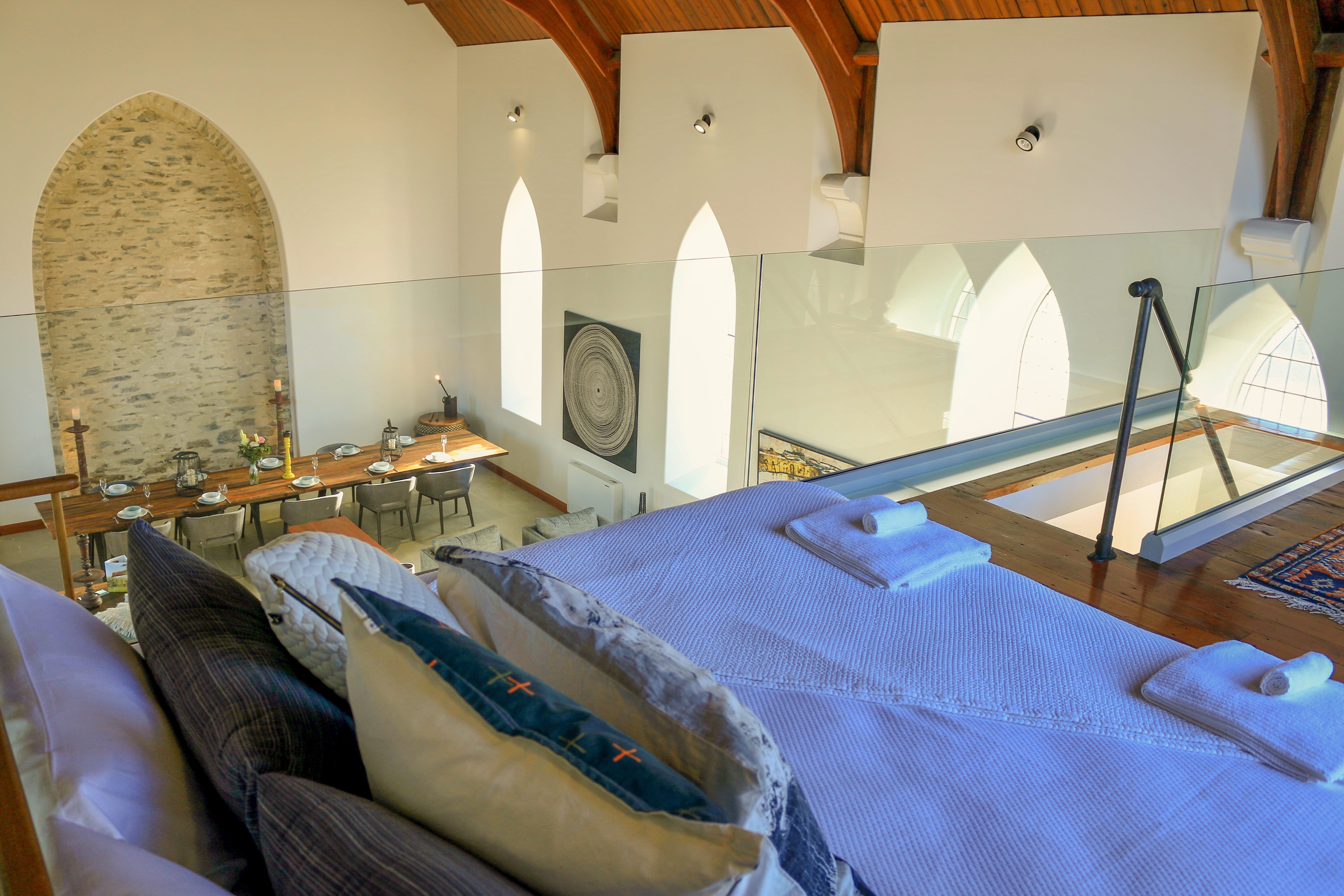 Loft bedroom in the converted stone temple luxury home